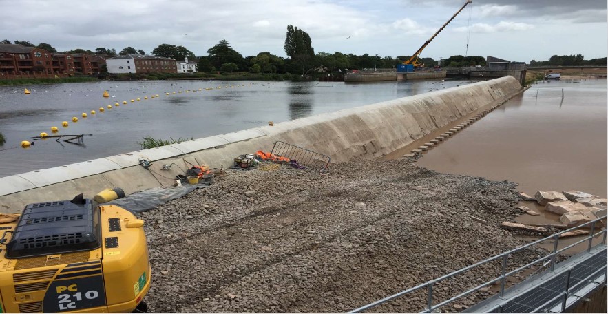 Large area of gravel on edge of river to make Fish Weir