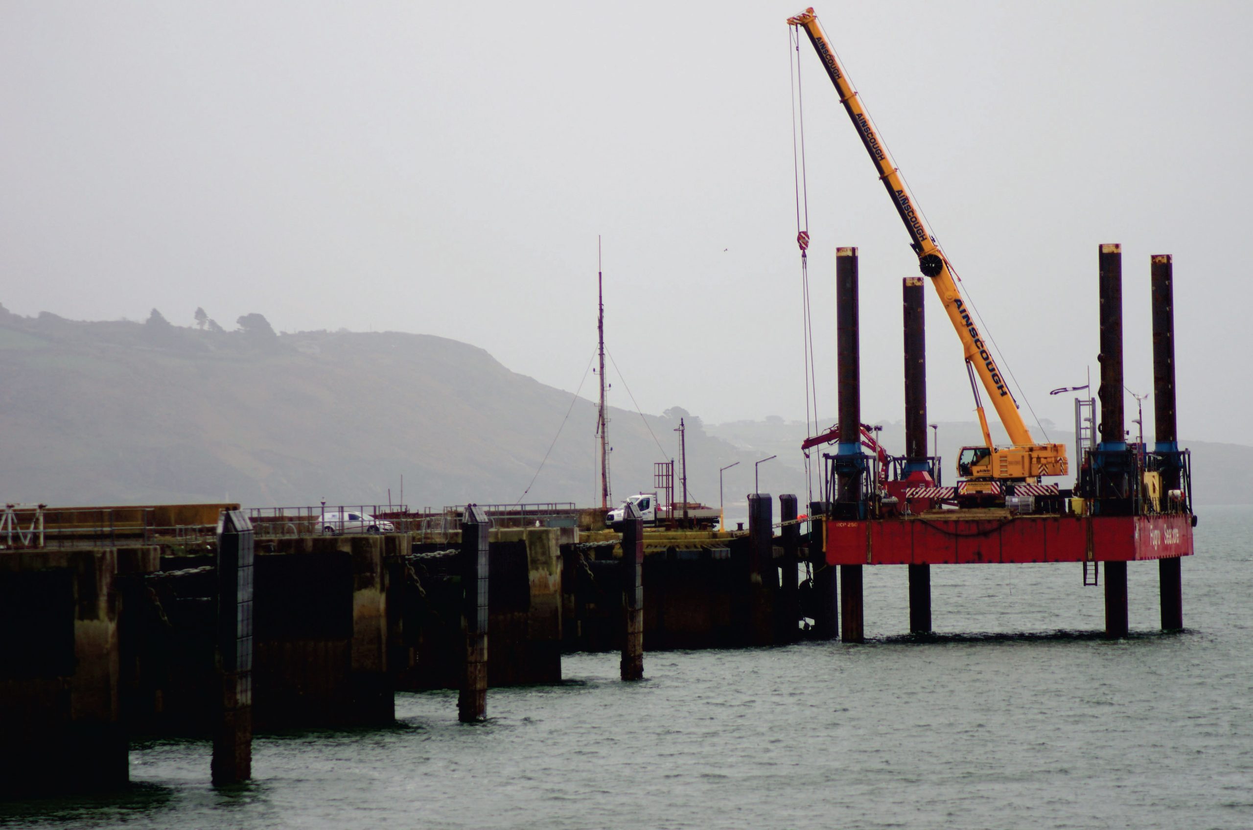Crane working from platform in the sea at Millbay