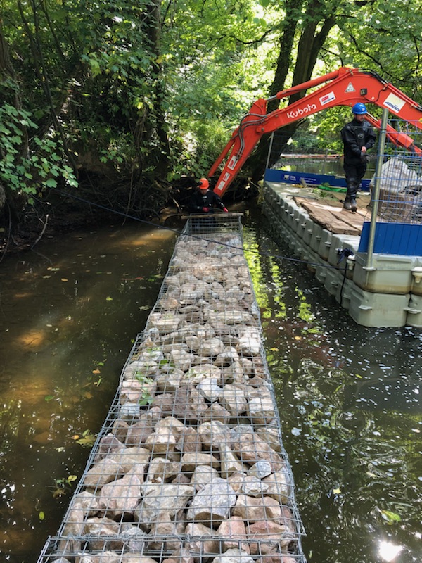 Gabion baskets filled with rocks at Newton St Cyres