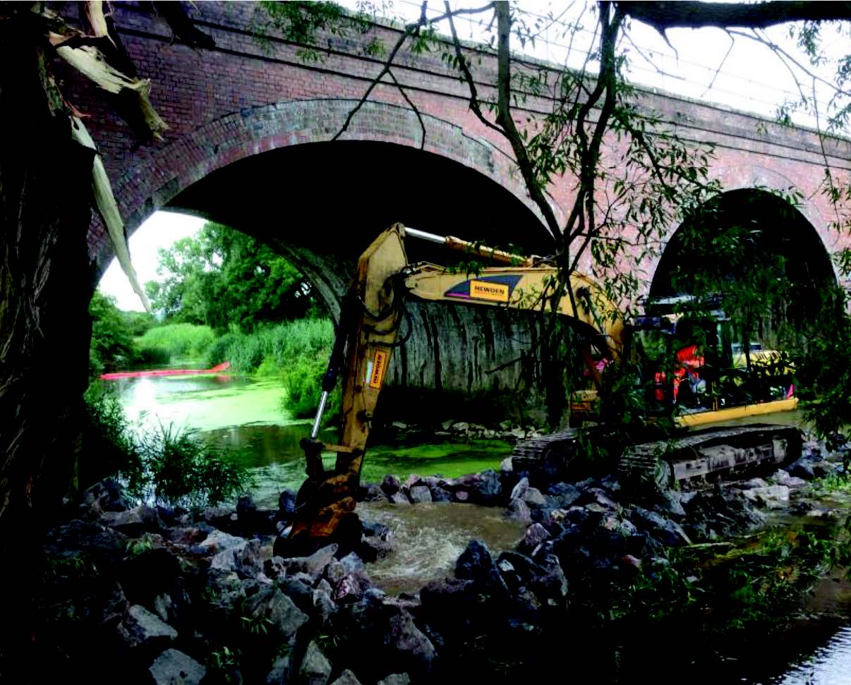 Digger working in river Chippenham River Avon Scour