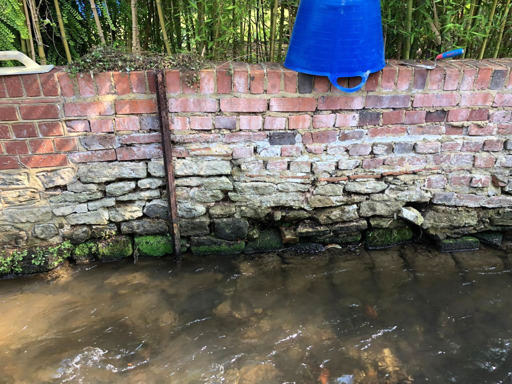 Supporting wall in need of repair at Shallow Ford