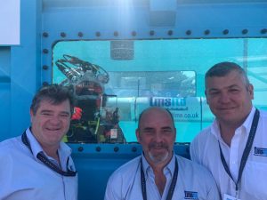 Three Men Smiling At Seaworks Exhibition